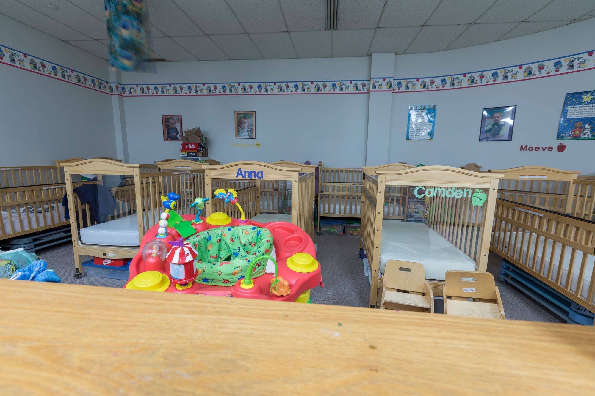 Photo of multiple cribs in the infant room at Lakewood Child Care Center