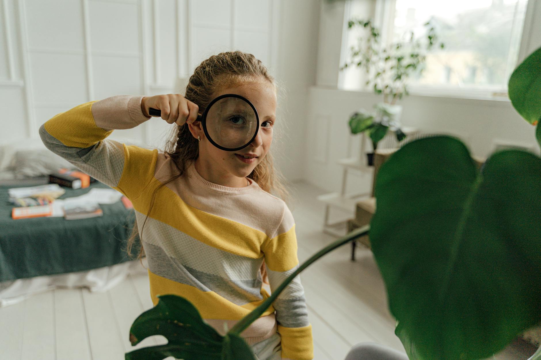 woman looking through a magnifying glass