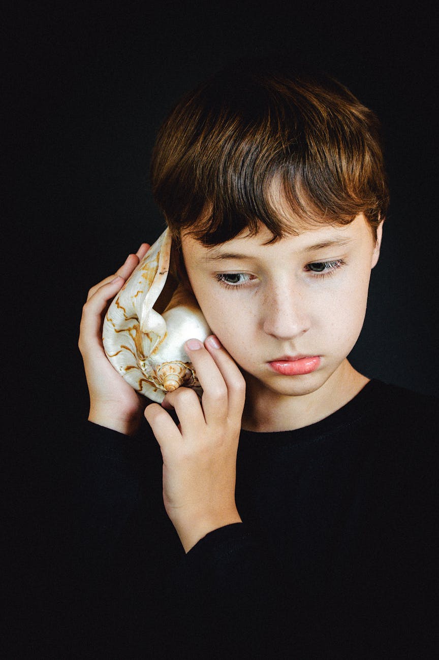 boy holding shell