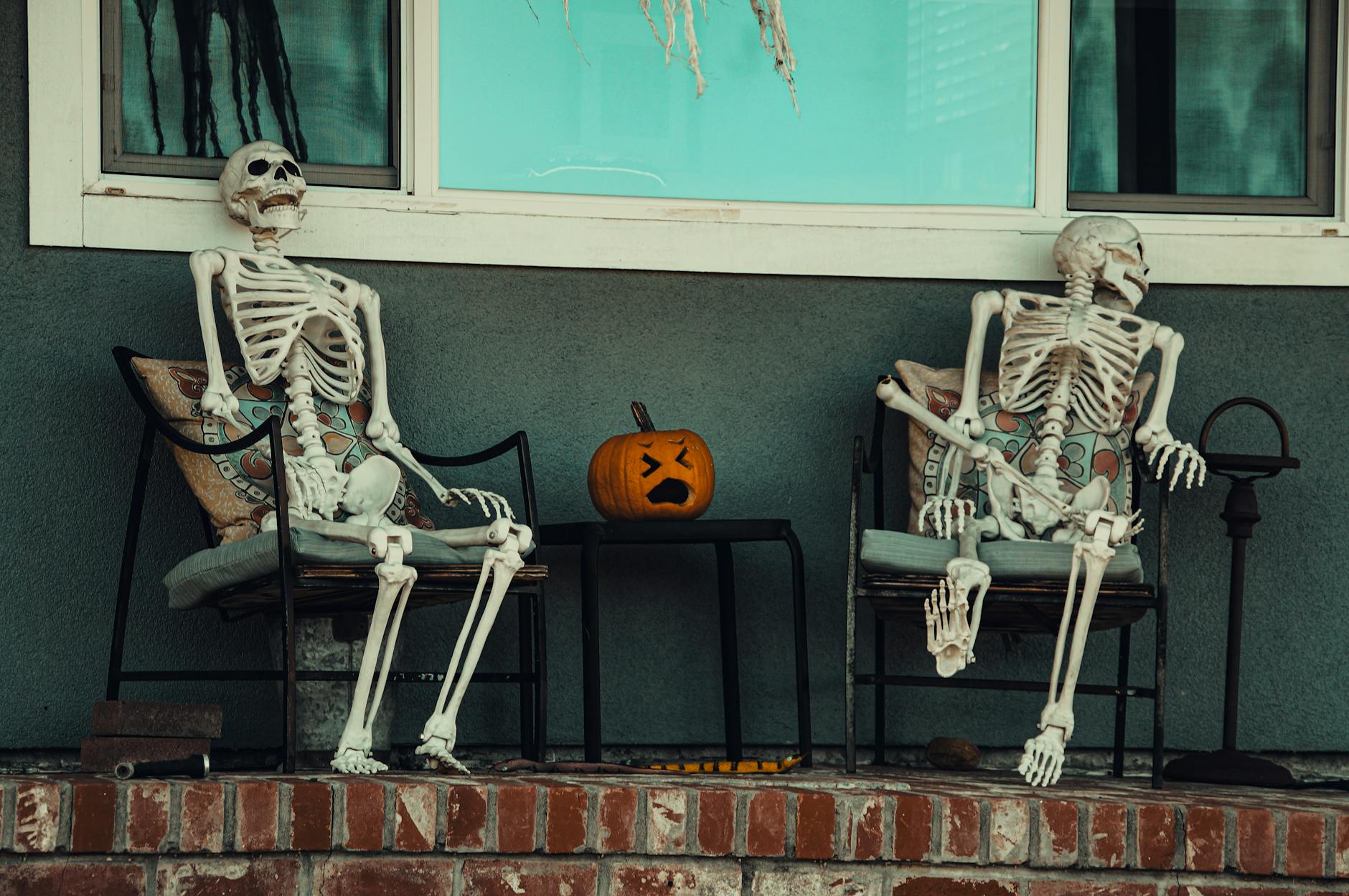 skeletons on chairs