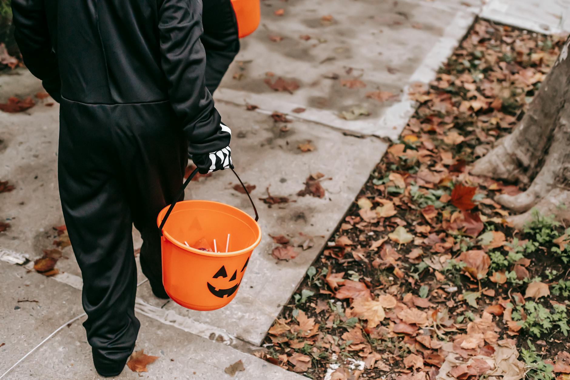 anonymous children trick or treating in halloween costumes