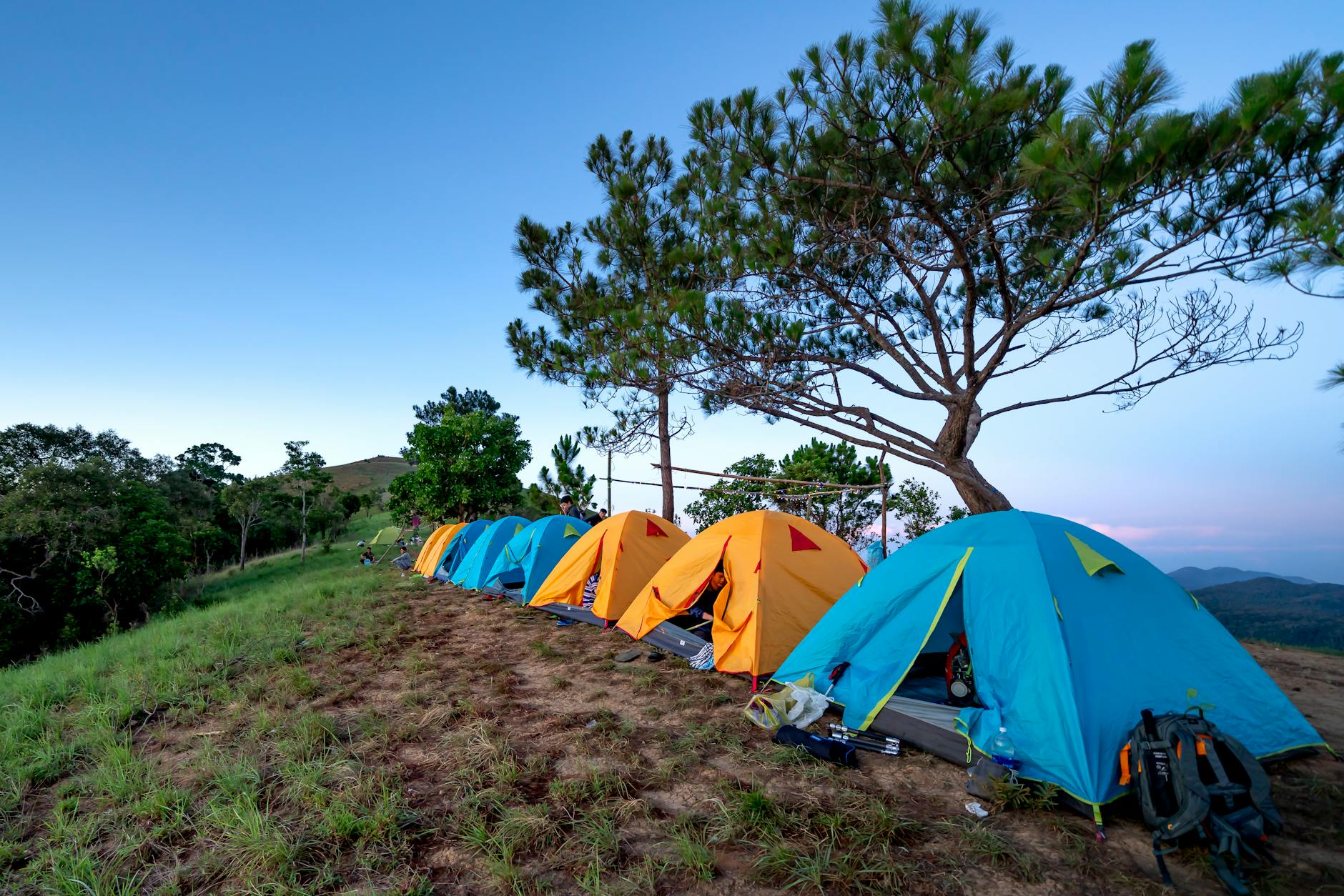 tents at campground in countryside during sunset